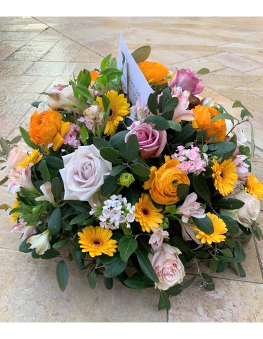 Colorful funeral round arrangement