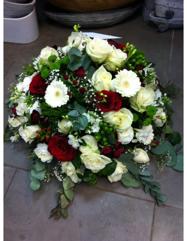 Red and white funeral round arrangement