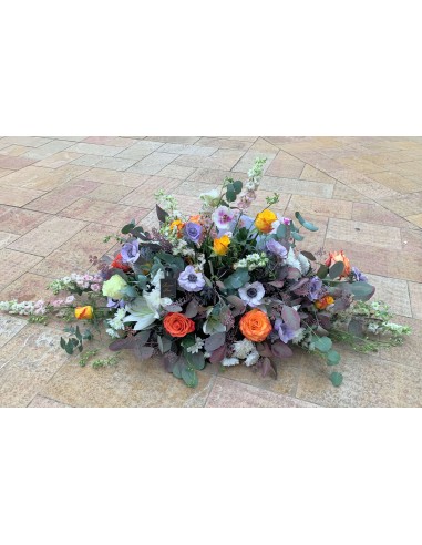 Colorful elongated funeral arrangement